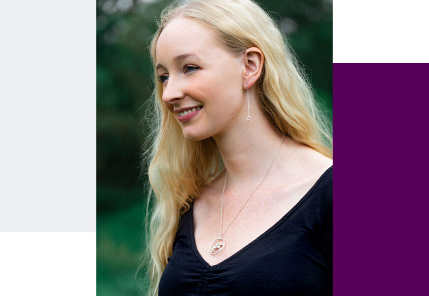 Model wearing horse pendant and snaffle earrings